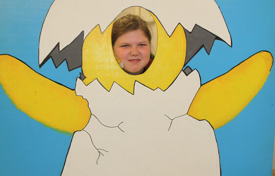 face in hole baby chick photo op